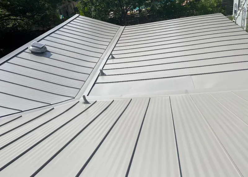 Solar attic fan installed on a metal roof for Roof Ventilation in Los Altos